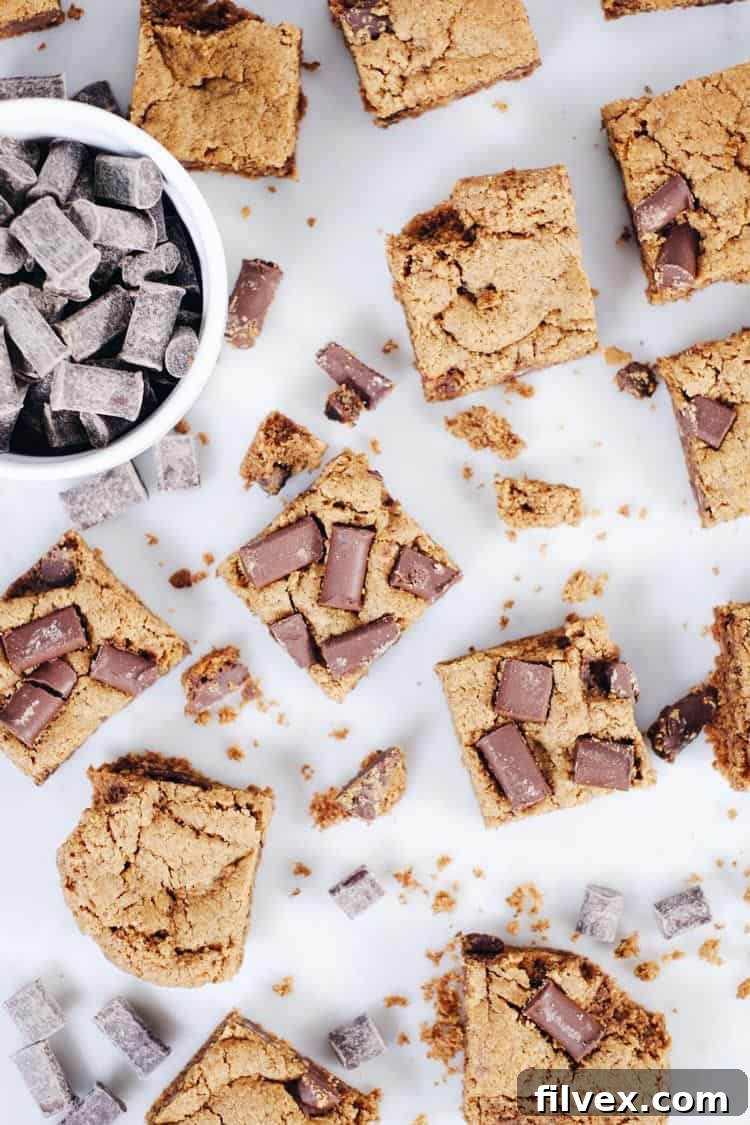 The perfect bake for gluten-free, dairy-free, and paleo chocolate chip cookie bars – slightly squishy in the center for ultimate chewiness. Remember to cool completely before slicing! | realsimplegood.com