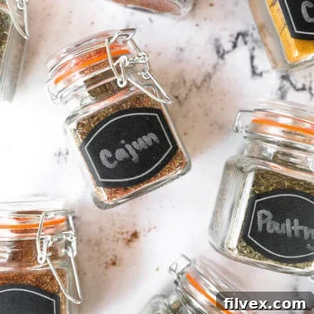 Homemade spice blends in jars laying on a countertop