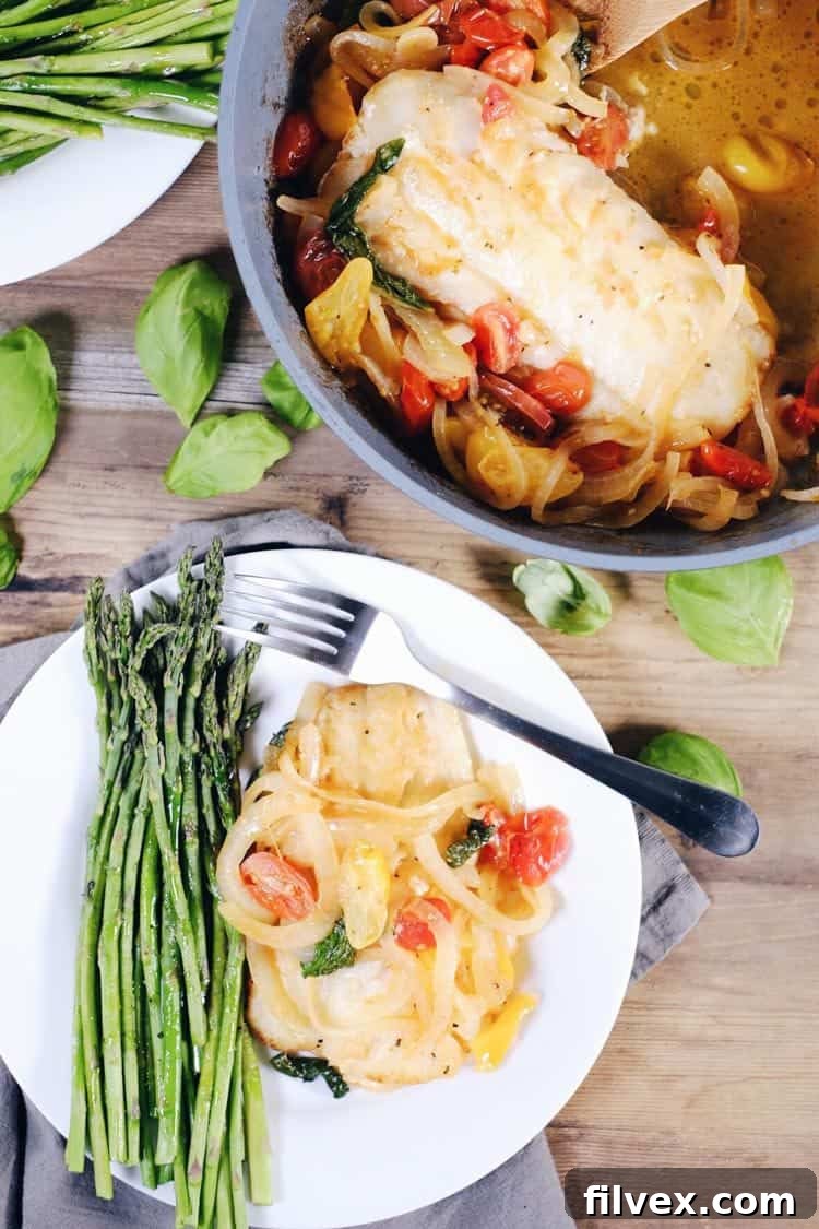This tomato basil cod with asparagus is a quick and easy favorite! It feels fancy, but is really a simple and quick Paleo + Whole30 meal! Paleo, Whole30, Gluten-Free + Dairy-Optional. | realsimplegood.com