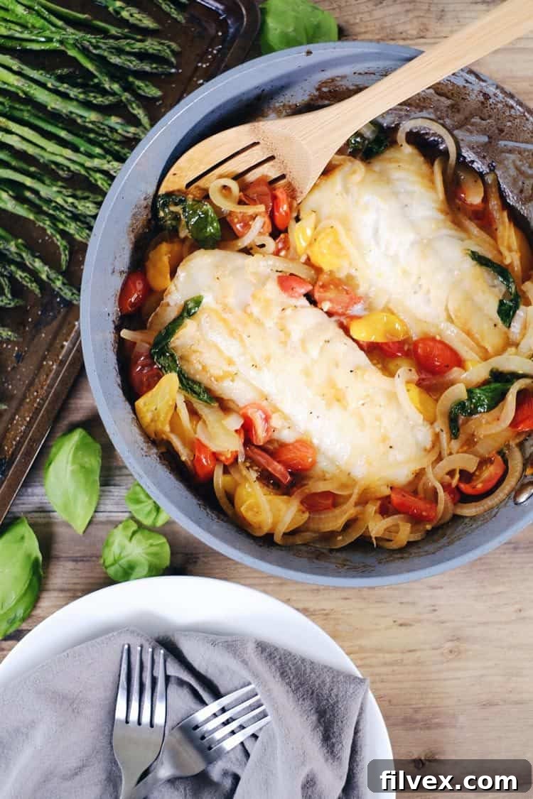 This tomato basil cod with asparagus is a quick and easy favorite! It feels fancy, but is really a simple and quick Paleo + Whole30 meal! Paleo, Whole30, Gluten-Free + Dairy-Optional. | realsimplegood.com